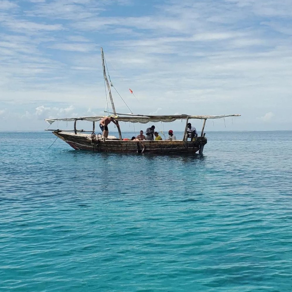 Traditional dhow on turquoise water